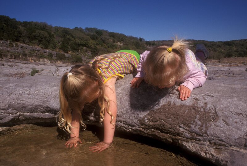 Children playing by a river