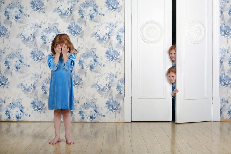Children Playing Hide-and-seek — Blue