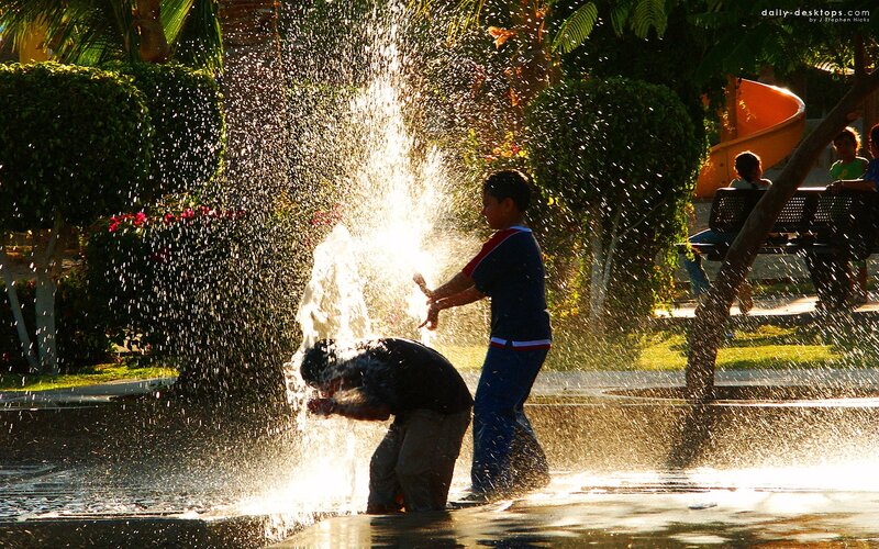 Children playing in a fountain
