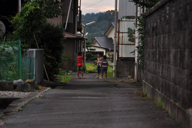 Children playing in a quiet alley