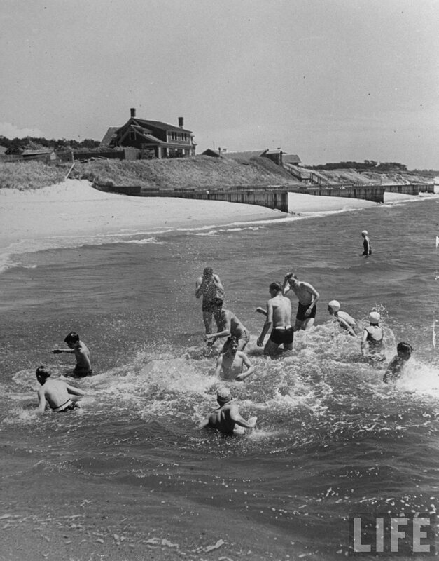 Children playing in ocean waves