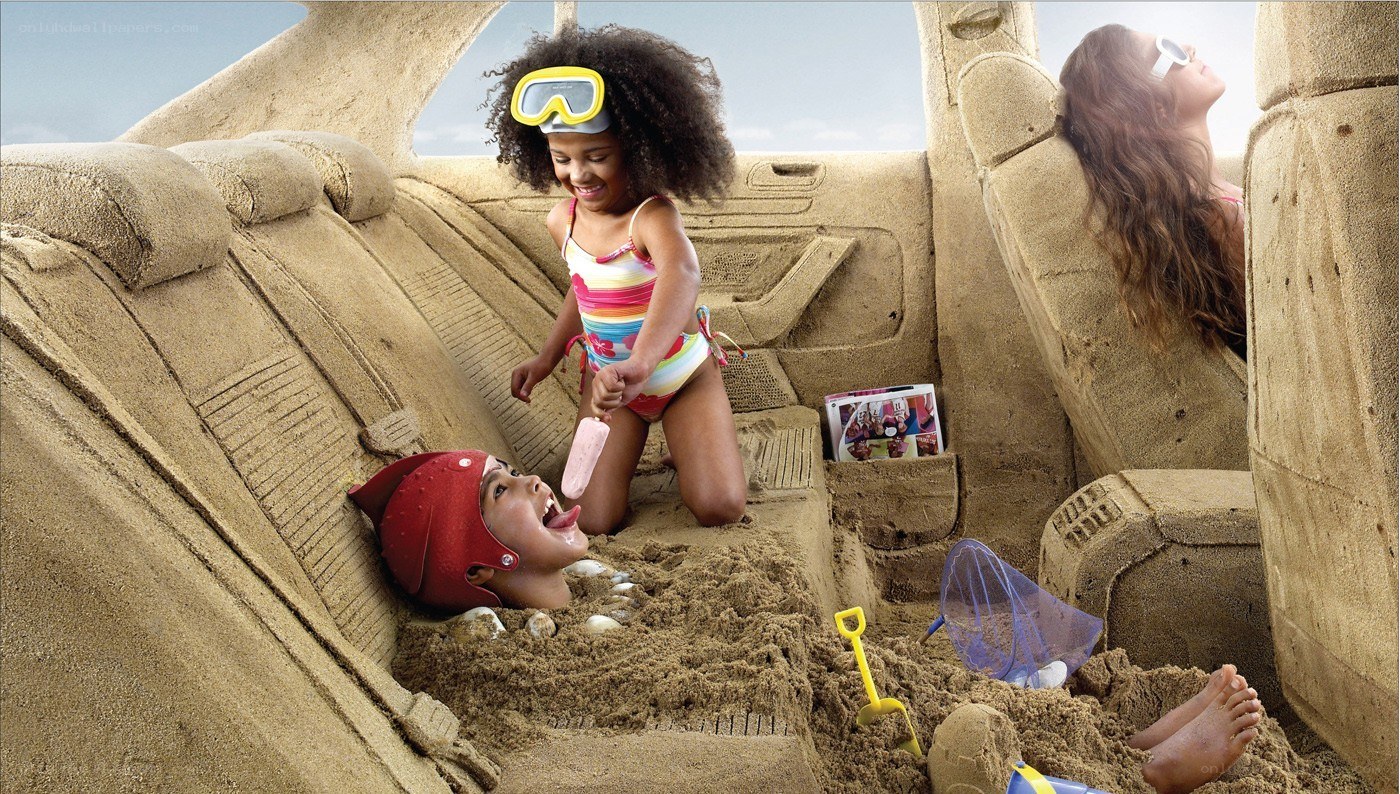 Children playing in sand car