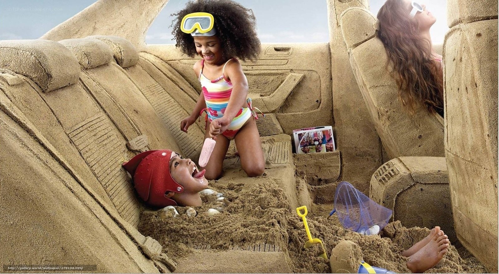 Children playing in sand car