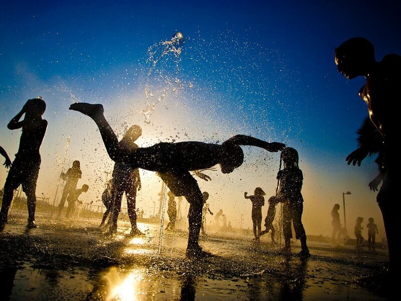 Children Playing in Water — Blue
