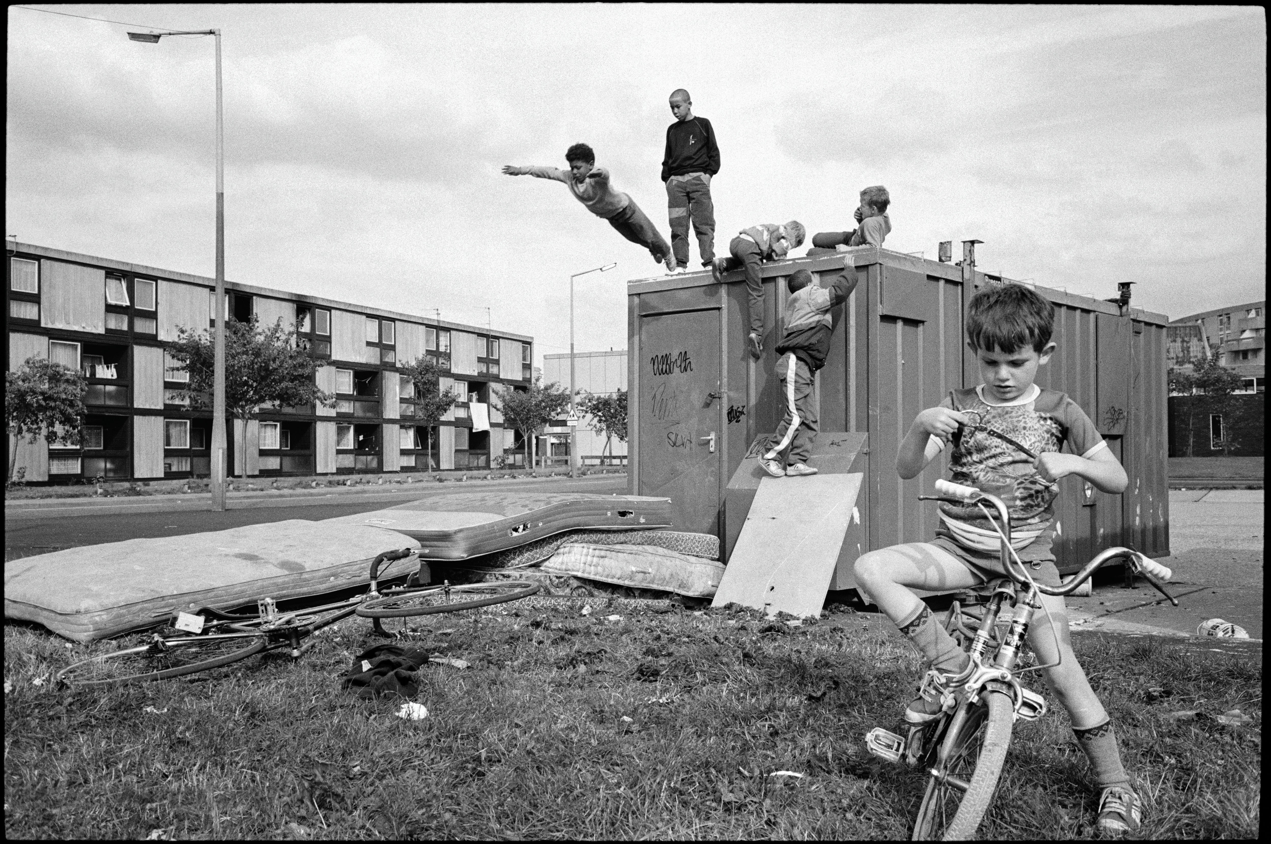 Children playing on a container