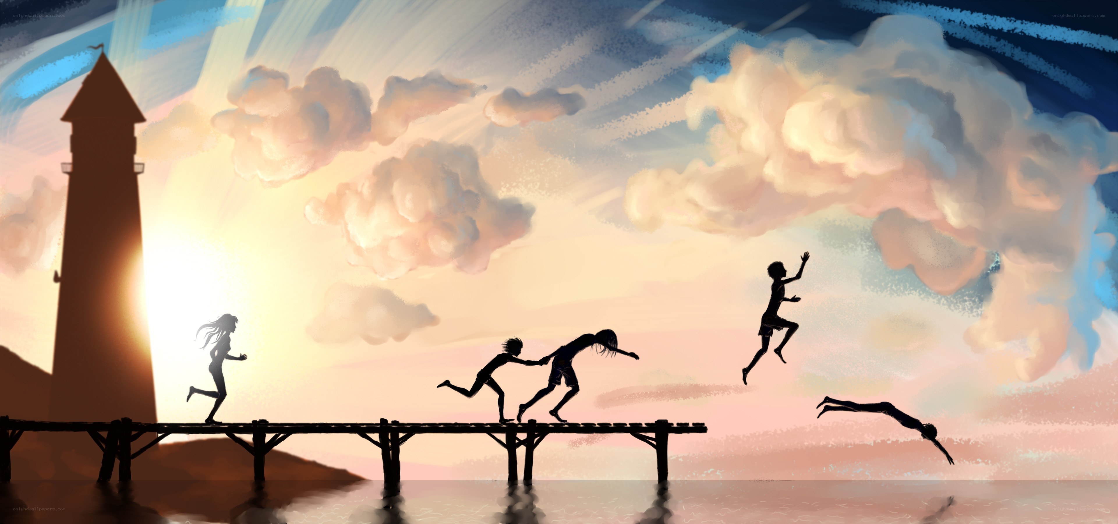 Children playing on a pier at sunset