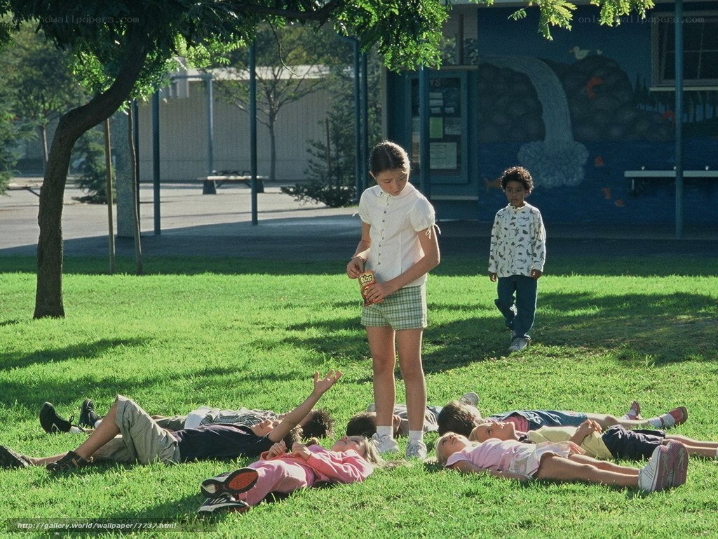 Children playing on a school lawn