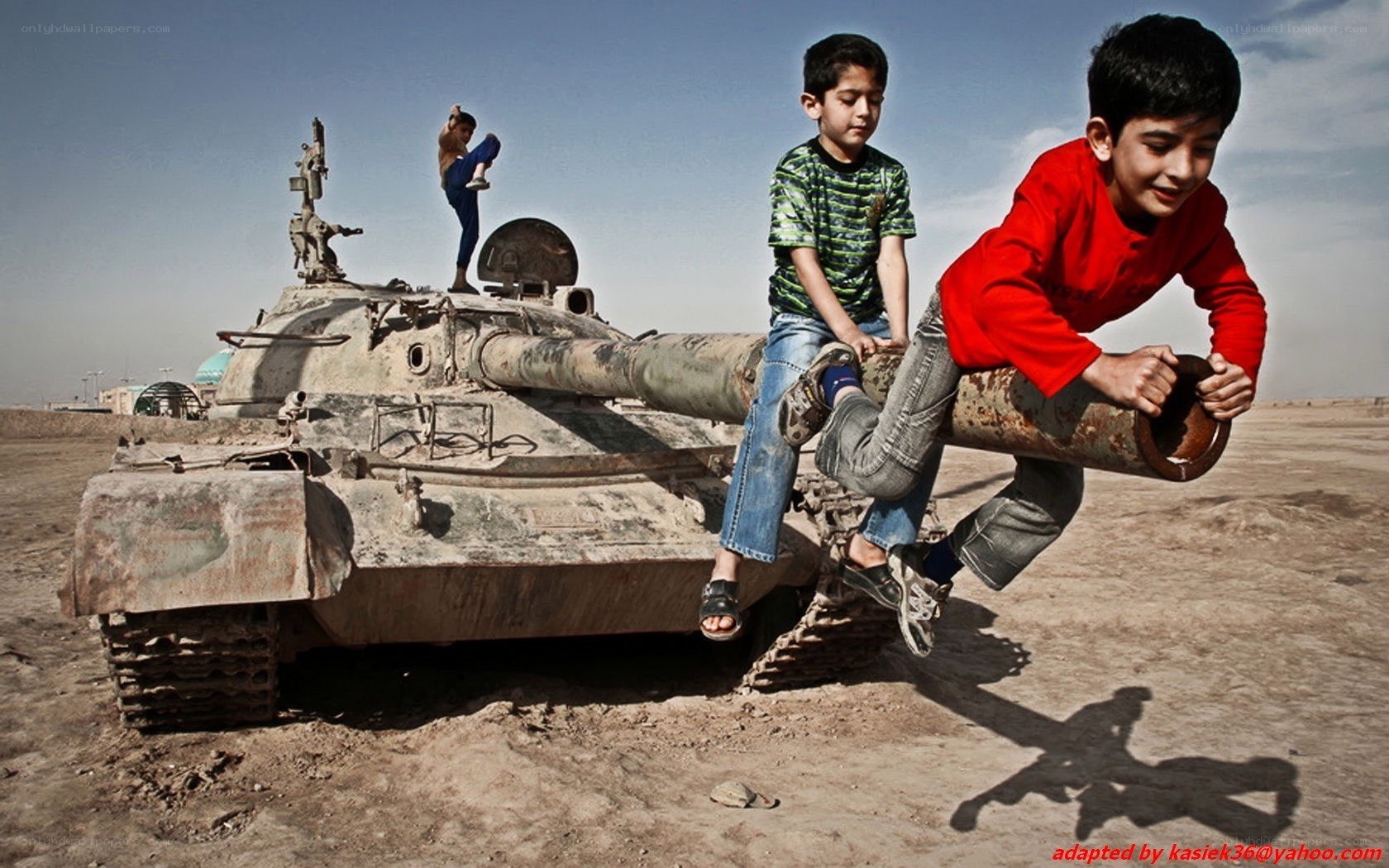 Children playing on a tank