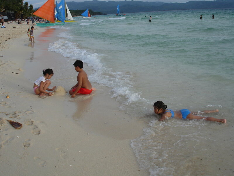 Children playing on a tropical beach