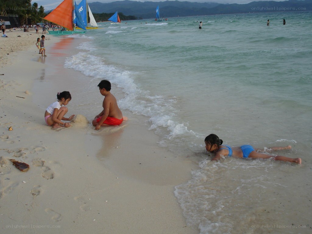 Children playing on a tropical beach