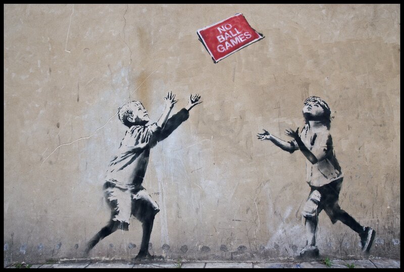 Children playing with a sign