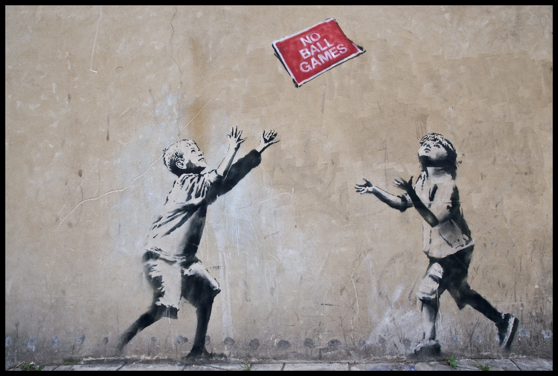 Children playing with a sign