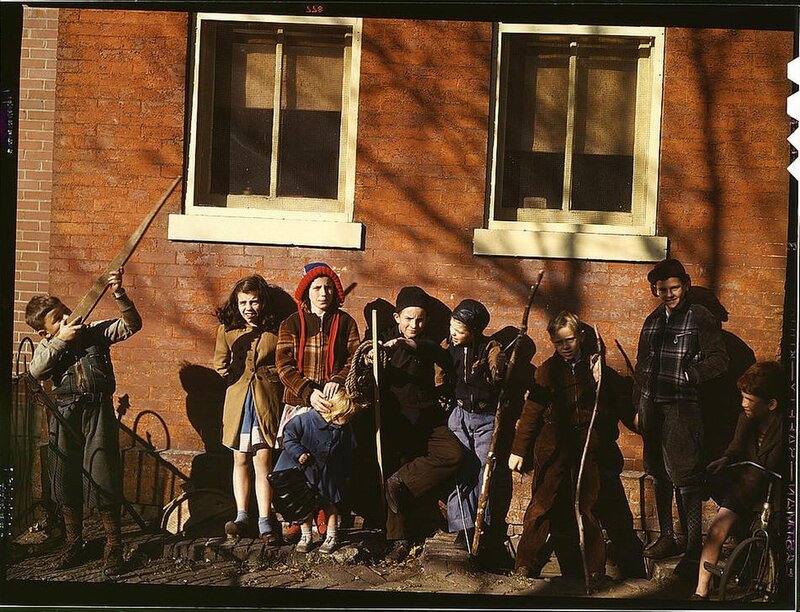 Children playing with sticks in alley