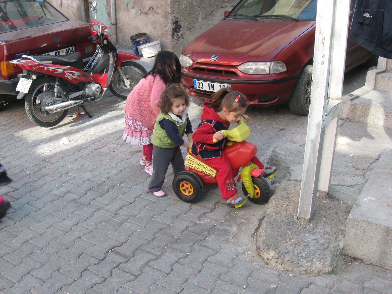 Children playing with toy car