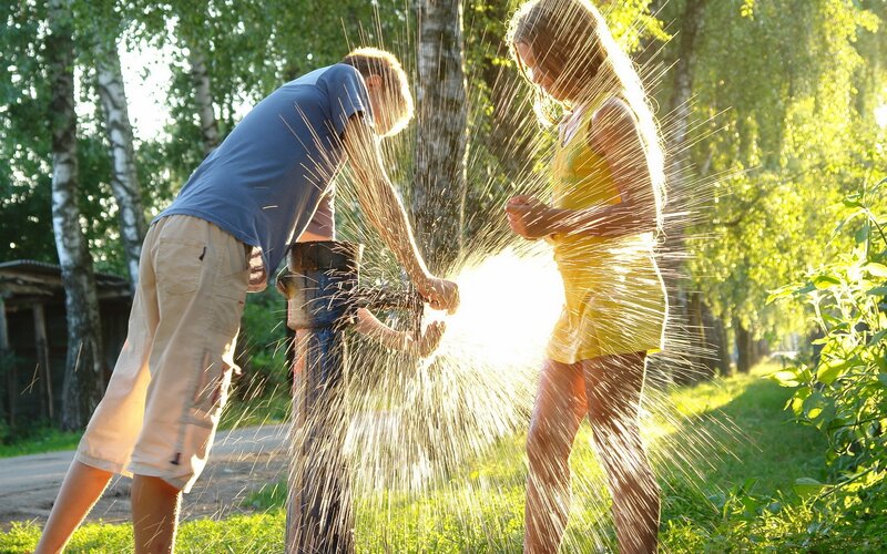 Children Playing with Water — Green, Playful