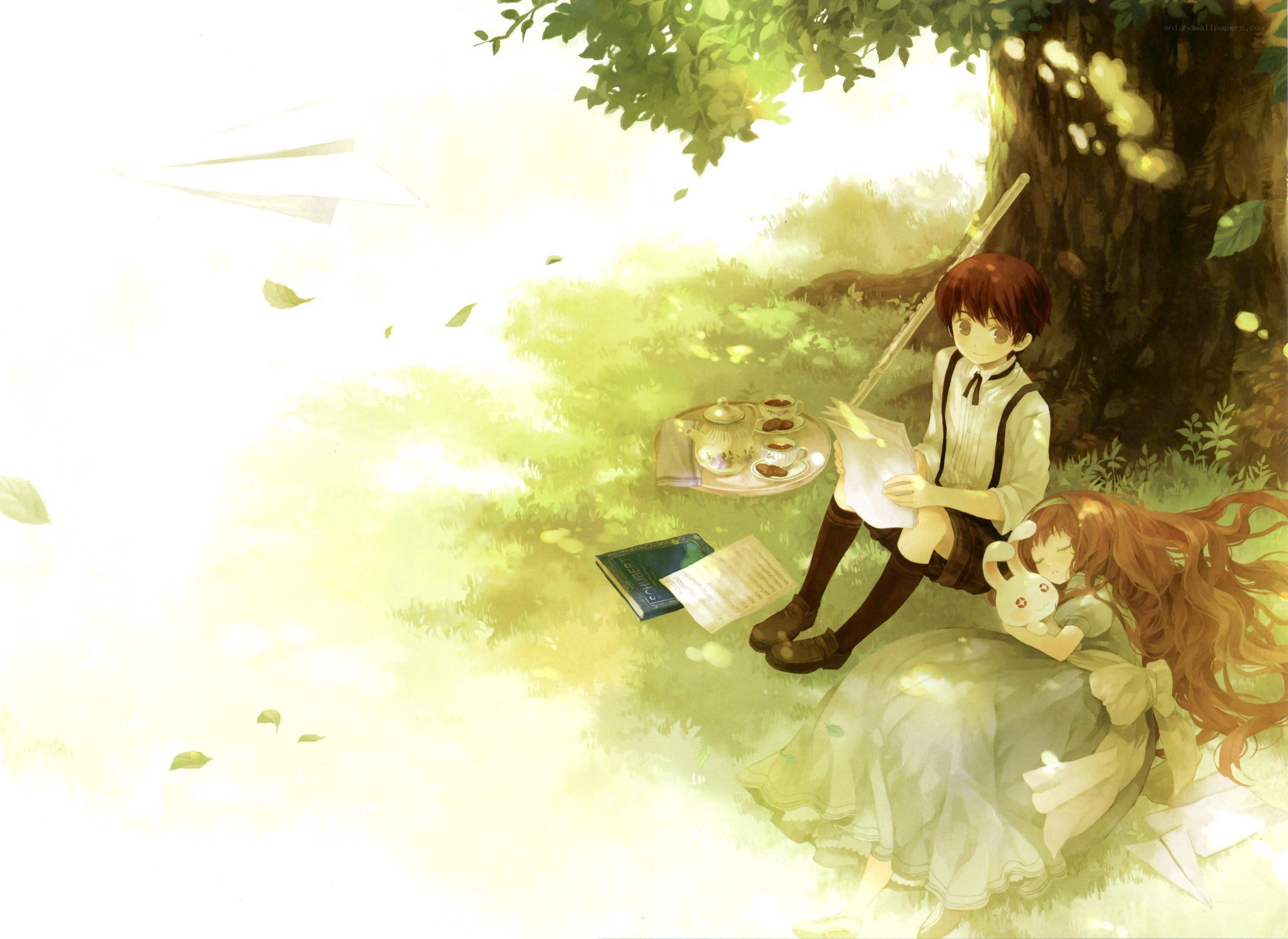 Children reading under a tree
