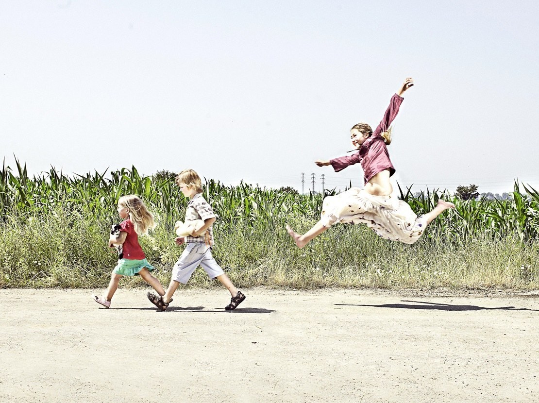 Children running in a field
