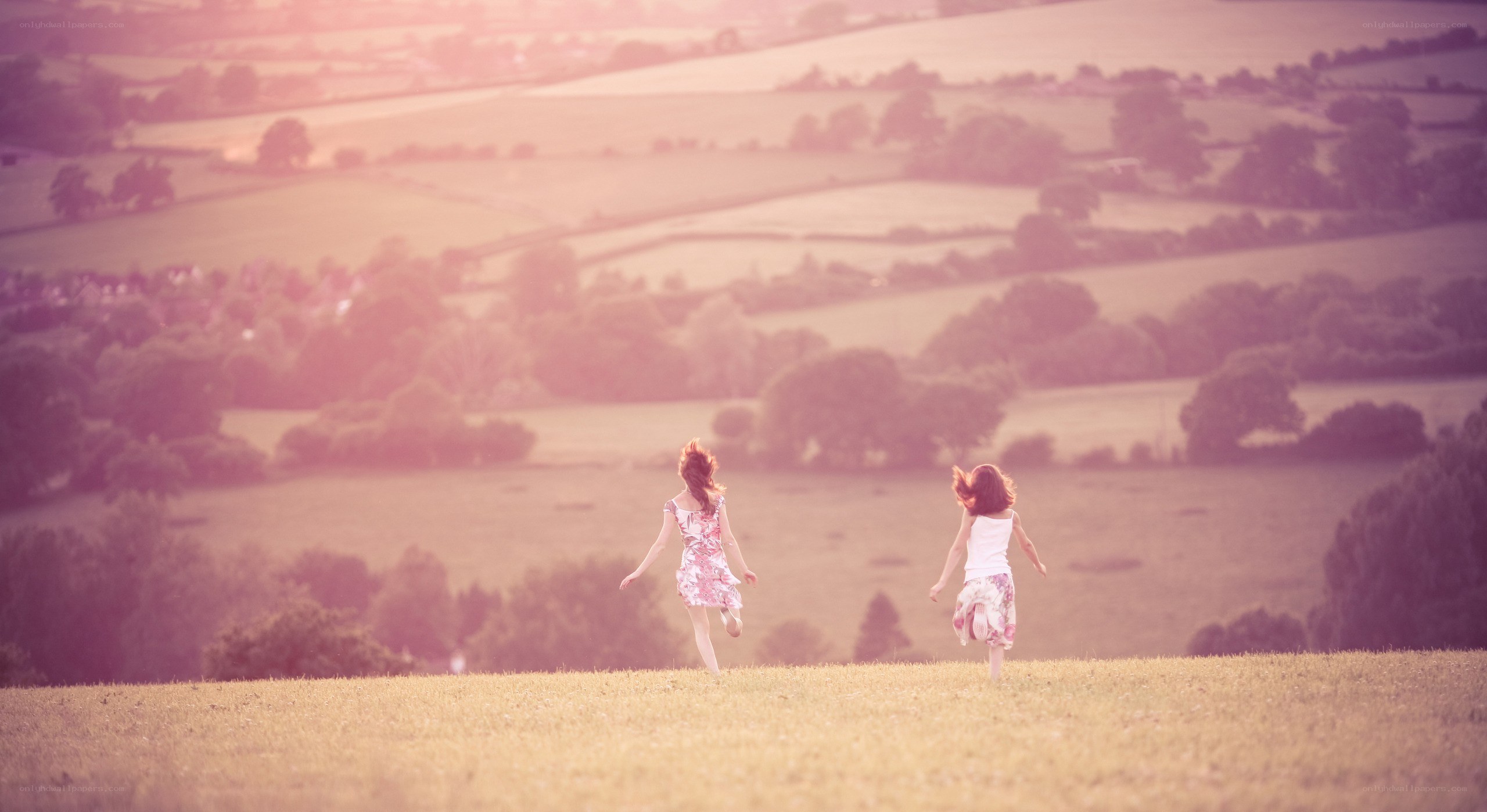 Children running in a field