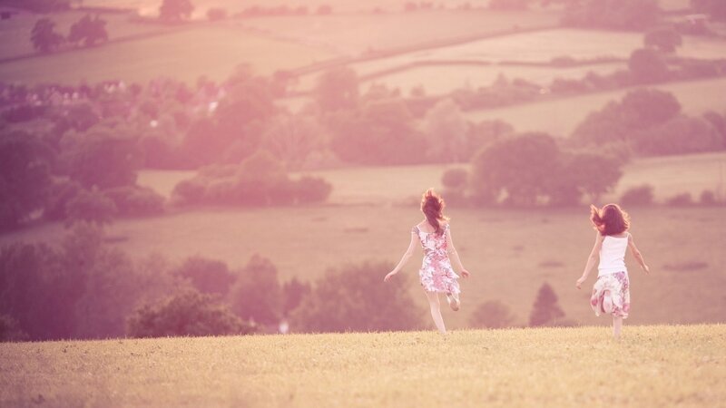 Children running in a field