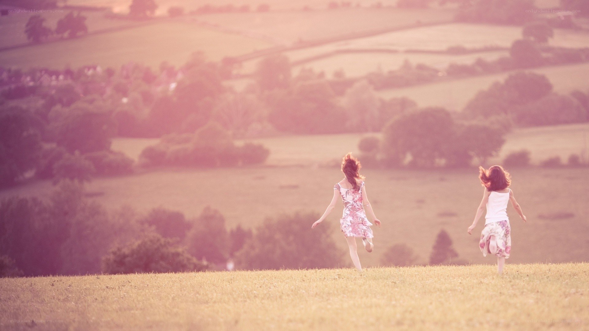 Children running in a field