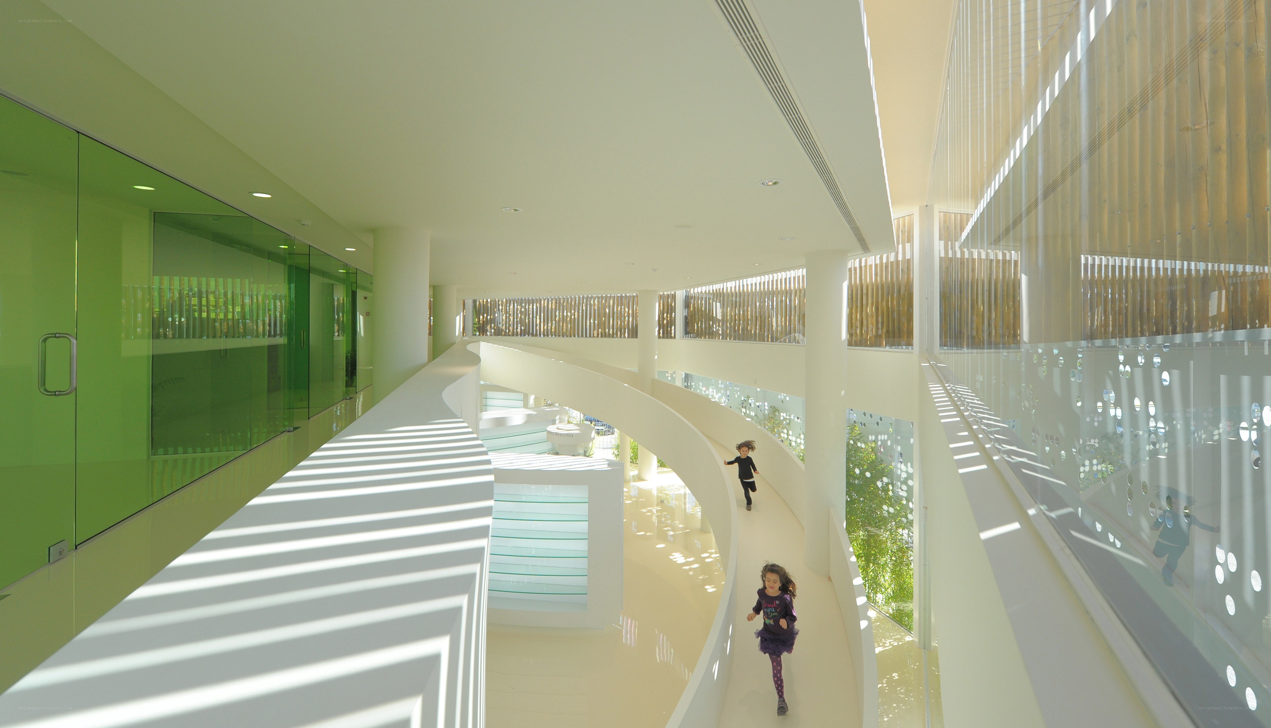 Children running in modern building