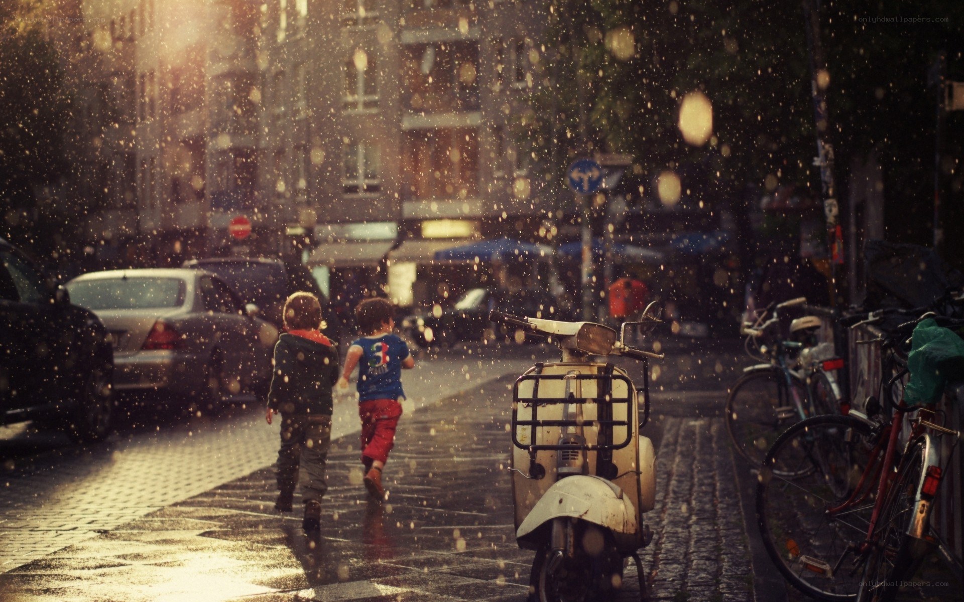 Children running in the rain
