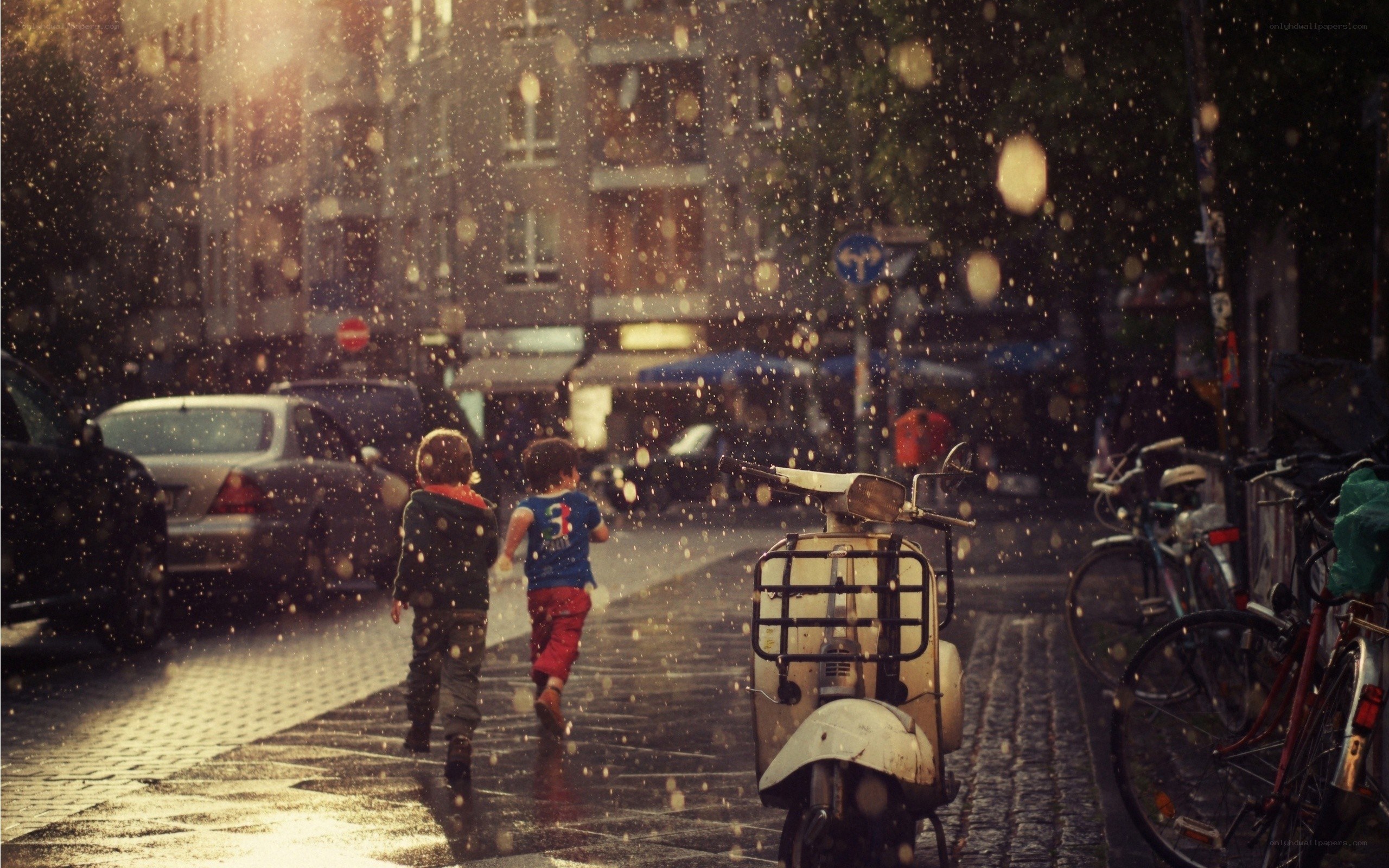 Children running in the rain