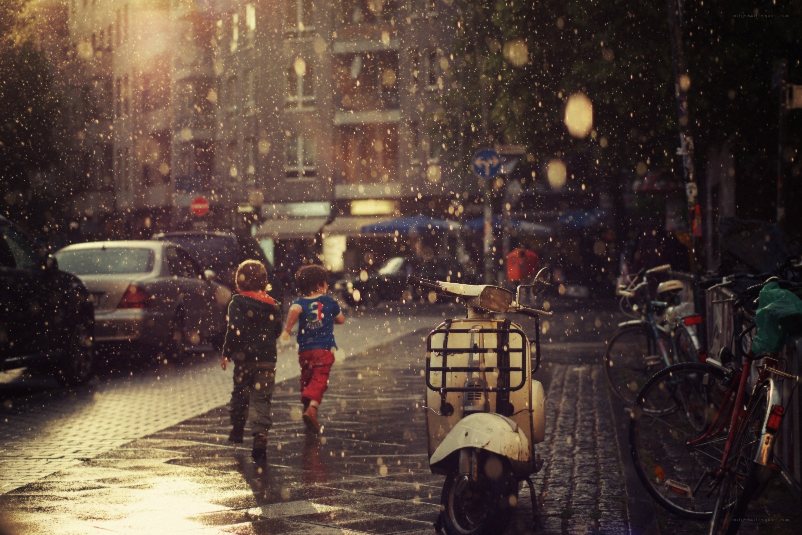 Children running in the rain