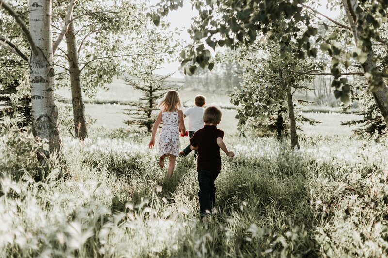 Children running through a field