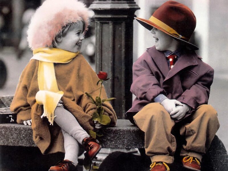 Children sharing a rose