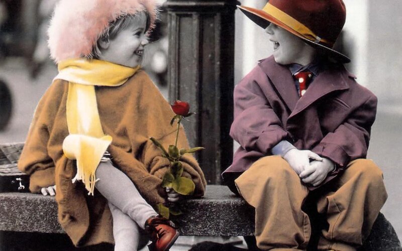 Children sharing a rose