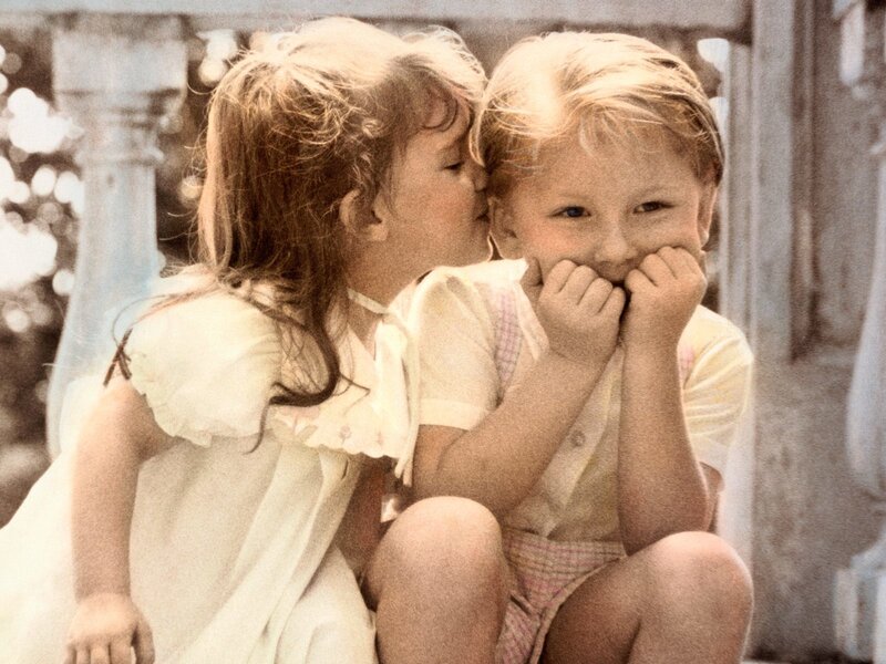 children sharing a secret