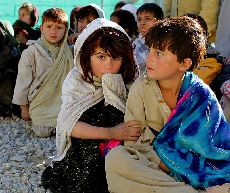 Children Sitting on Gravel