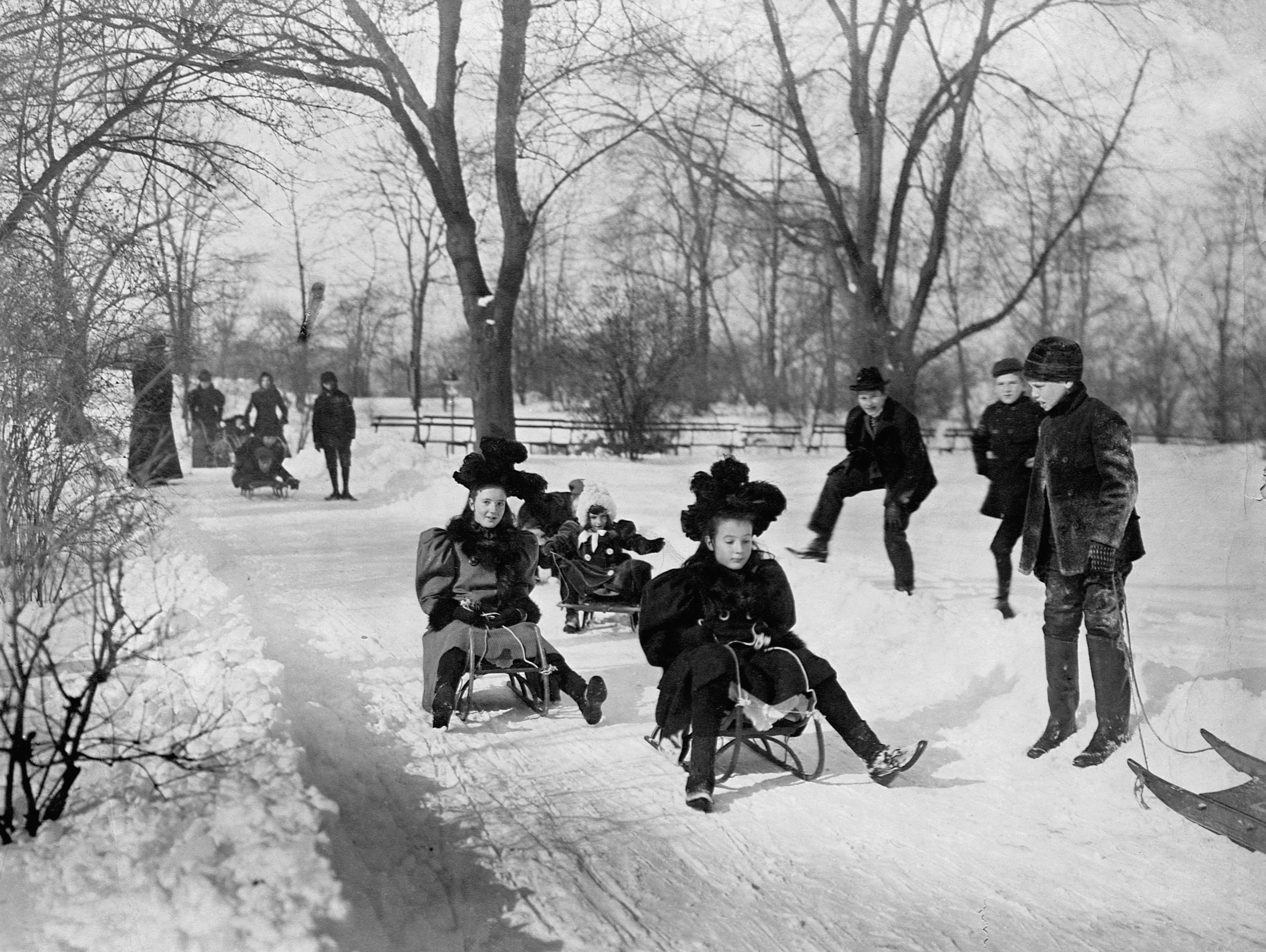 Children sledding in winter park