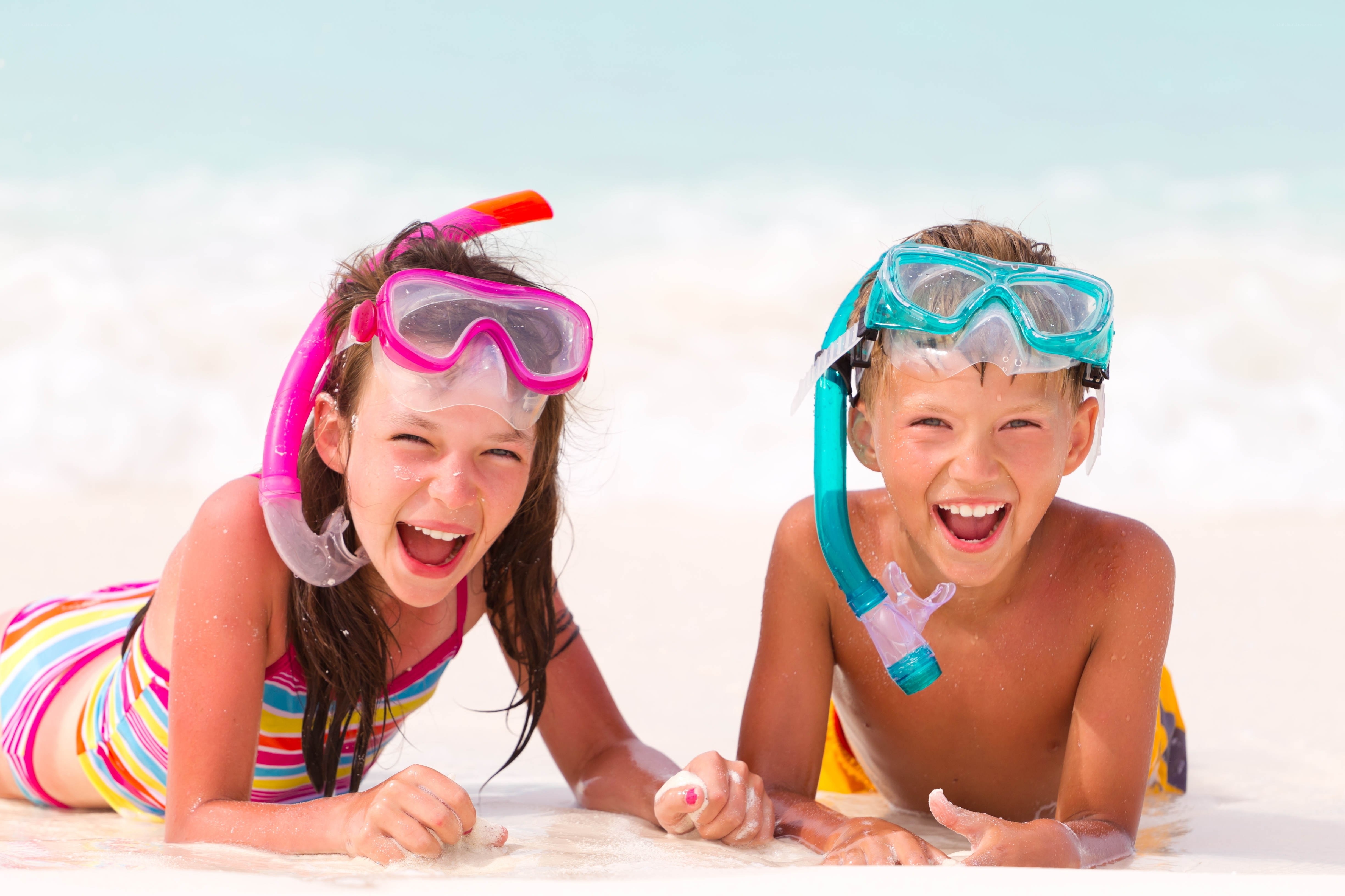 children snorkeling on beach
