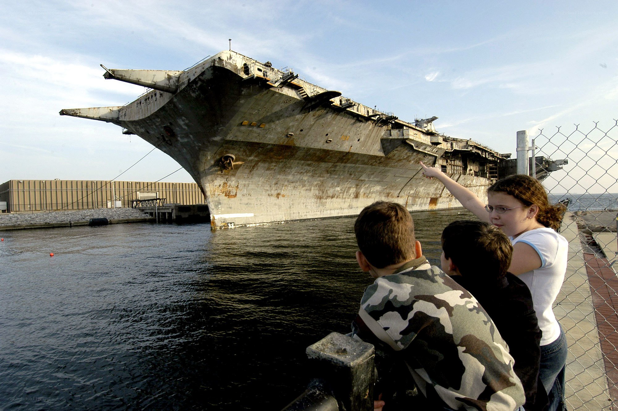 Children viewing aircraft carrier