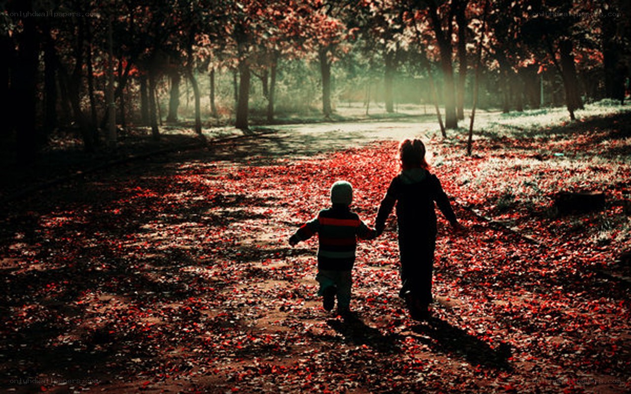 Children walking in autumn forest
