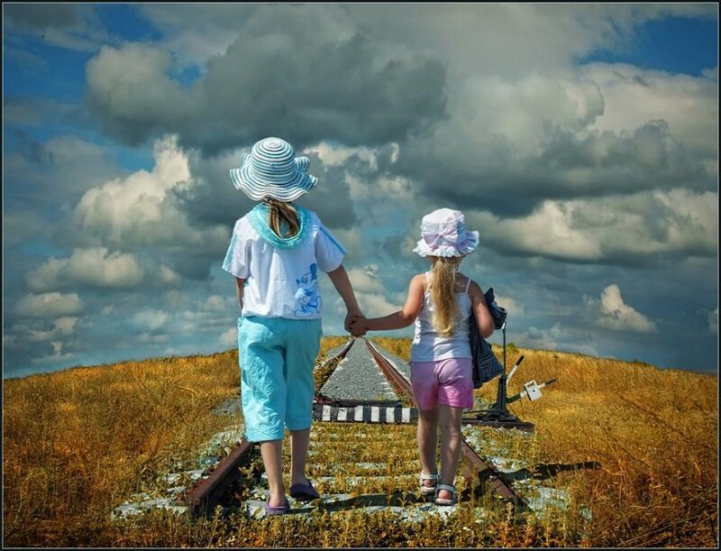 Children walking on train tracks