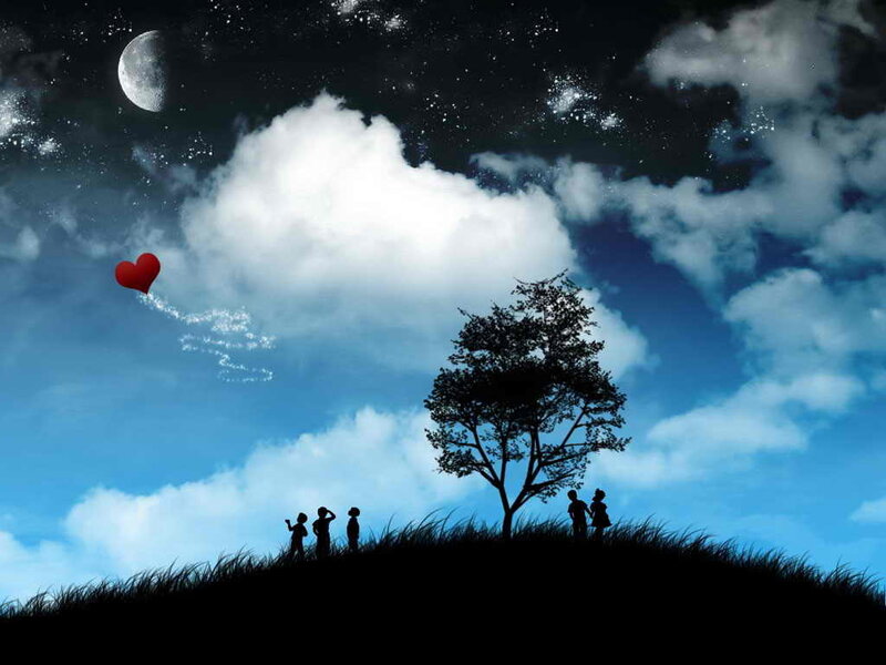 Children watching heart balloon at night