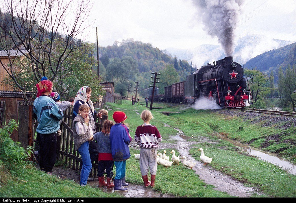 Children watching steam train pass
