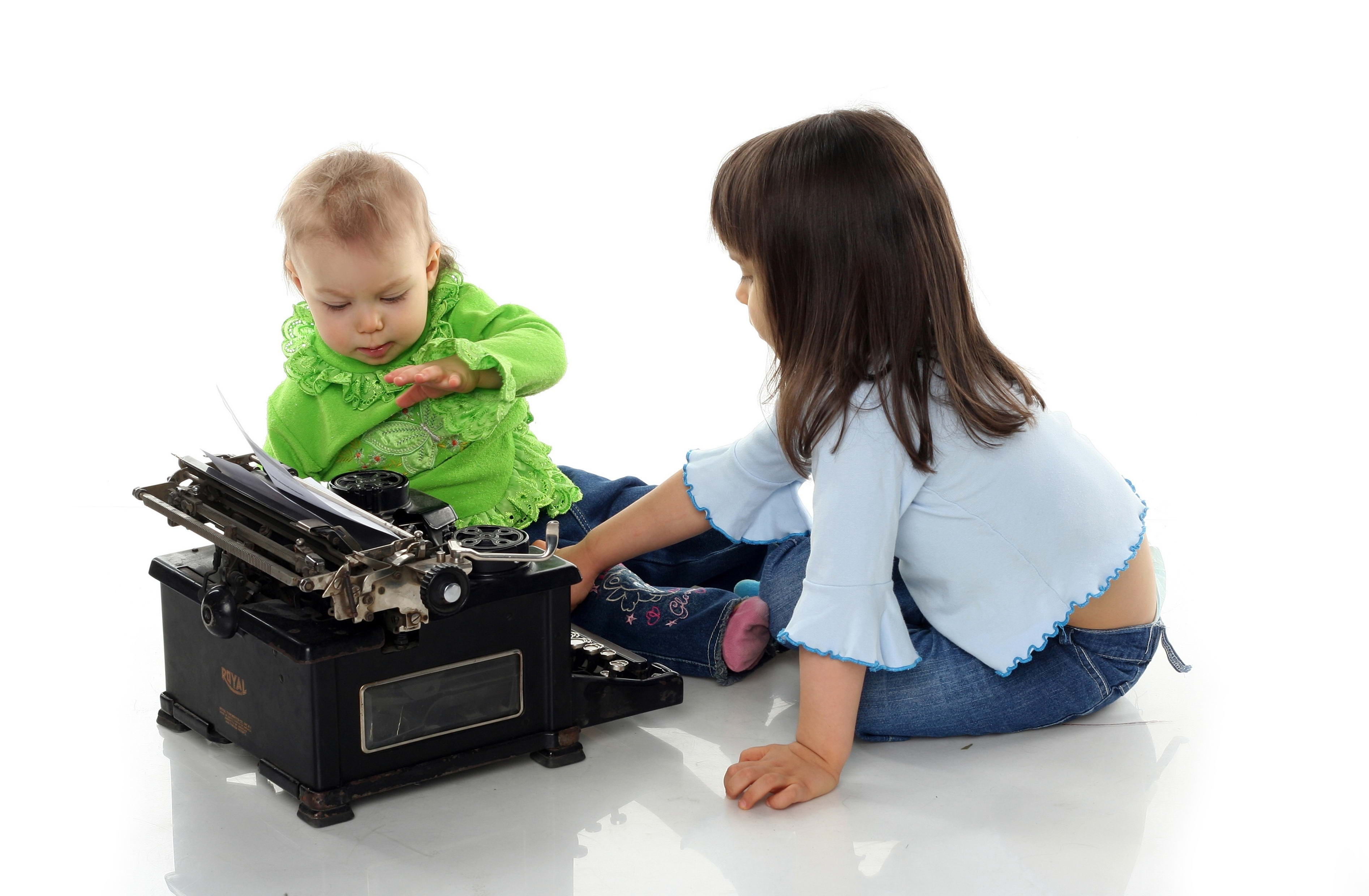 Children with a vintage typewriter