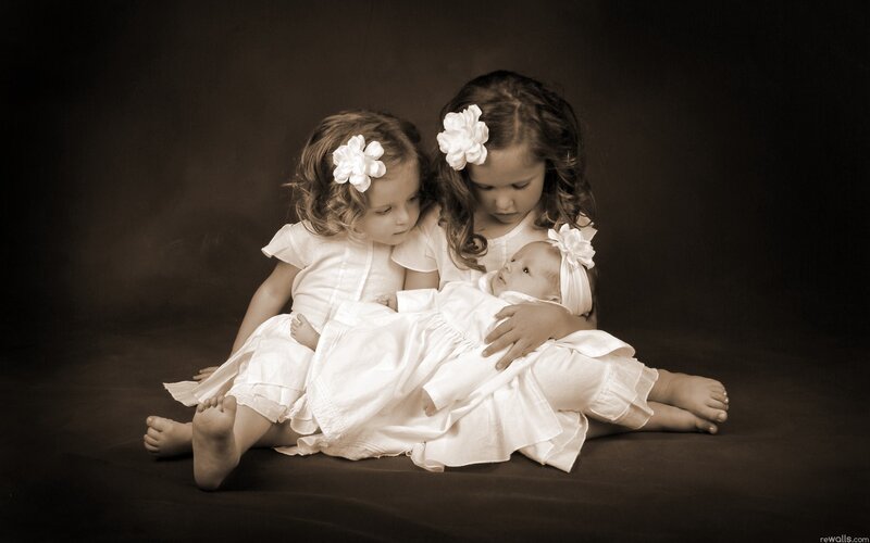 children with baby in white dresses
