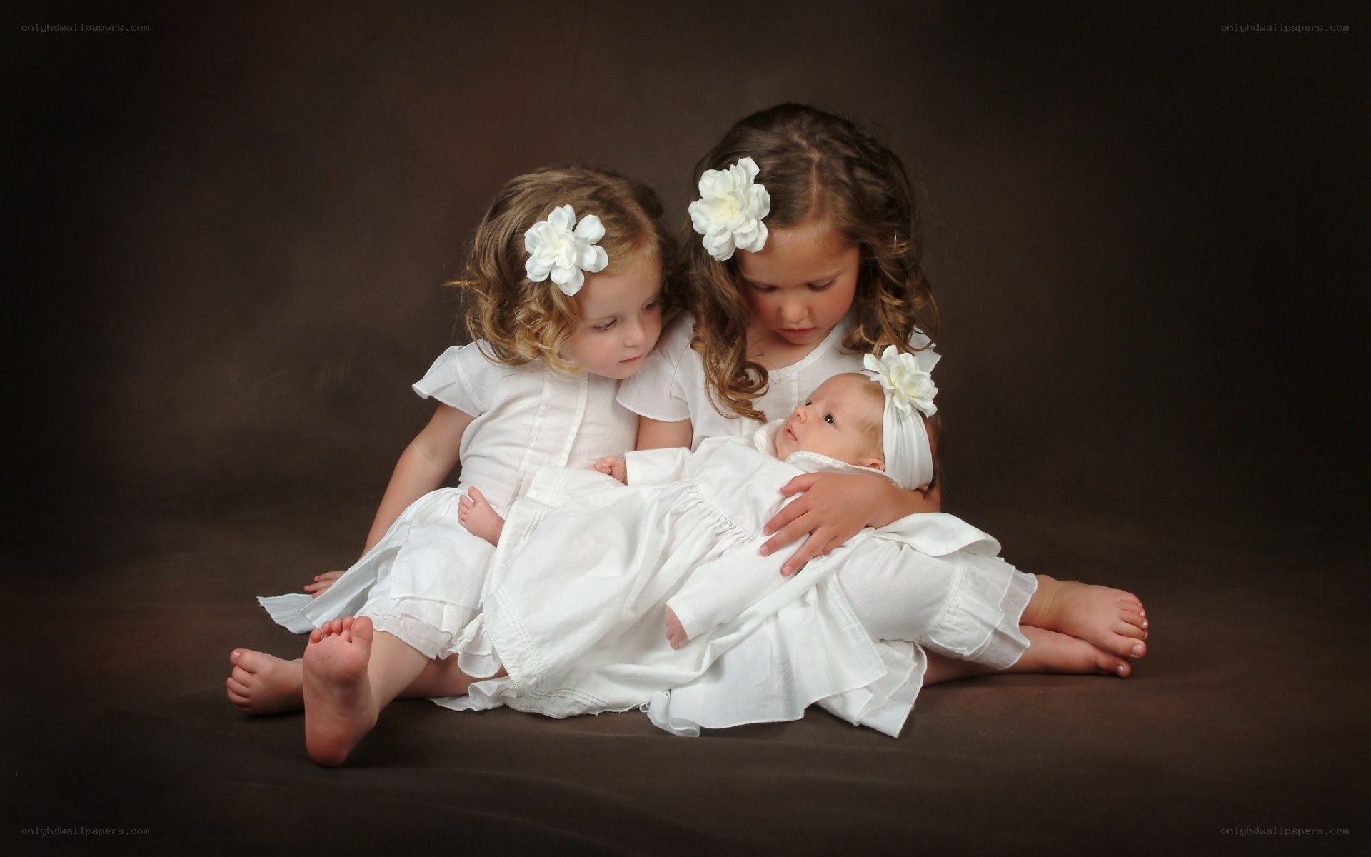 children with baby in white