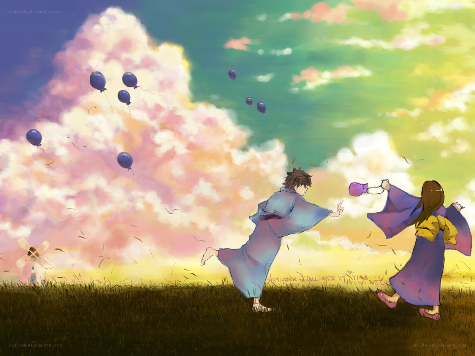 Children with balloons in a field