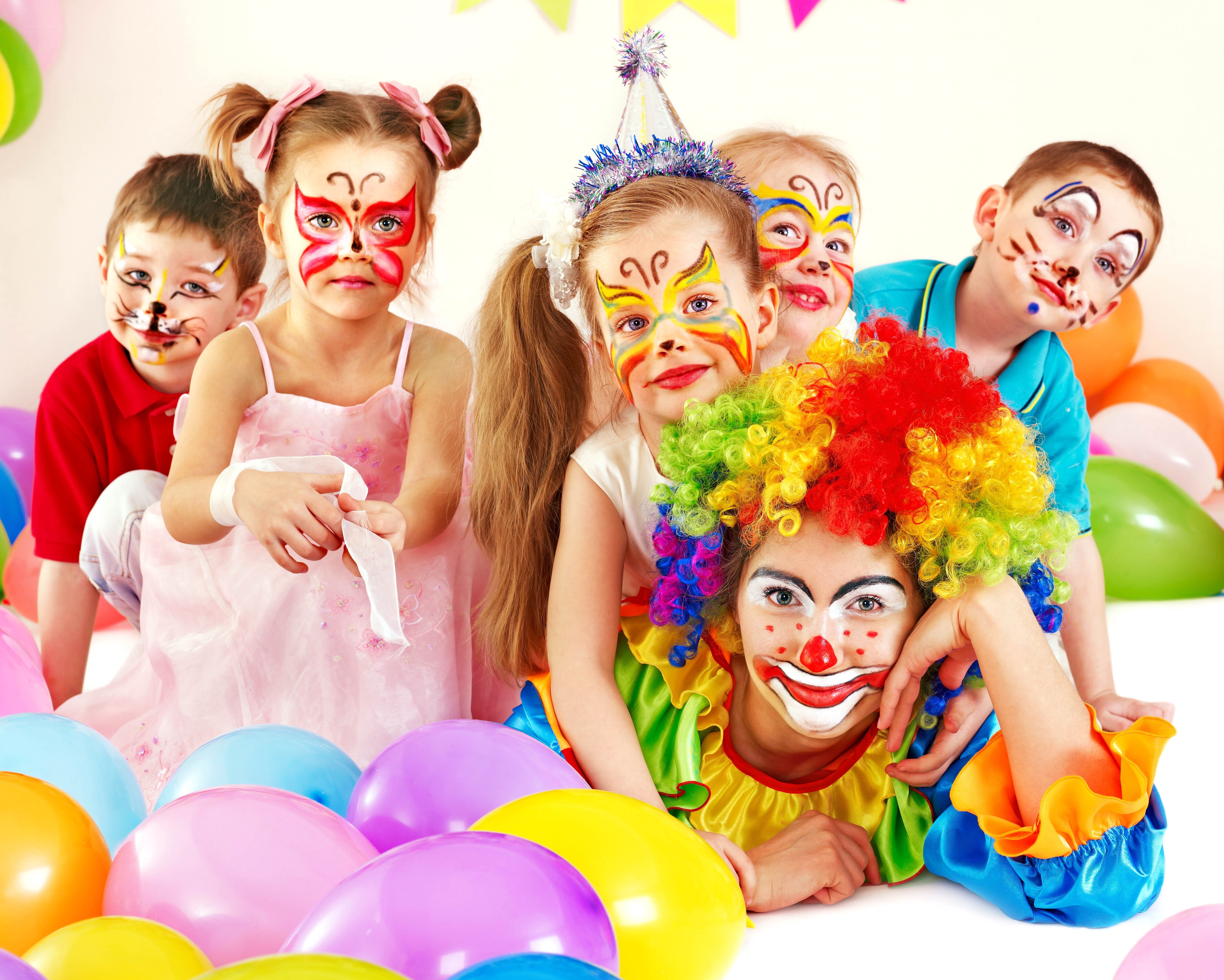 children with clown face paint