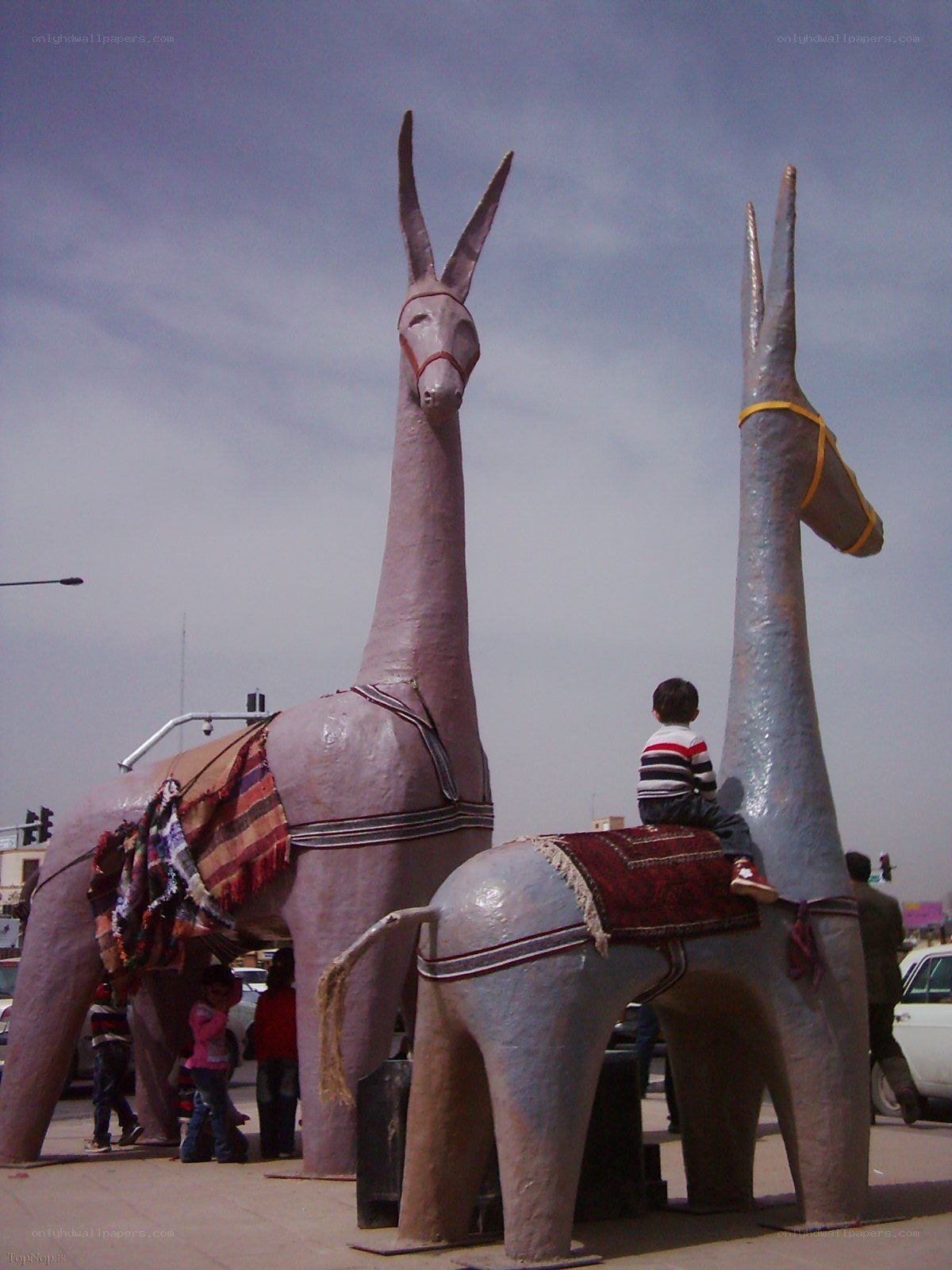 Children with large donkey sculptures