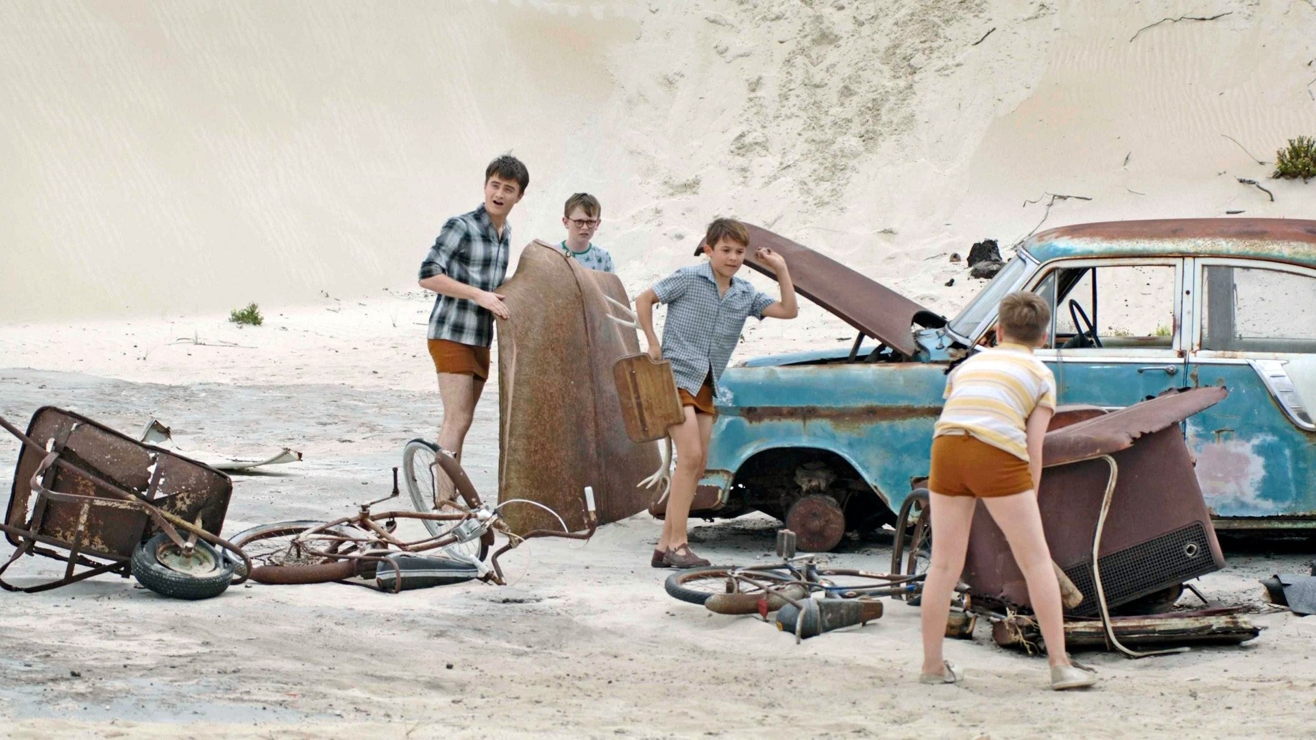 Children with old car parts