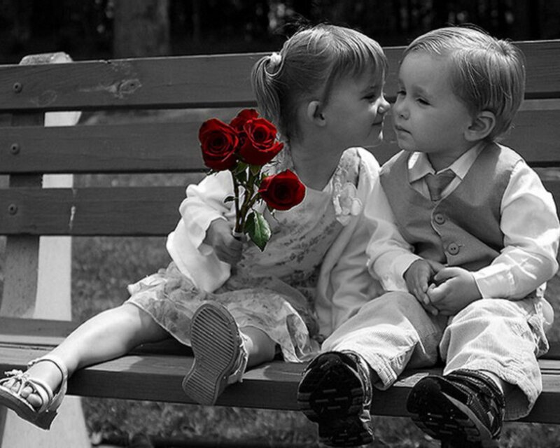 children with red roses