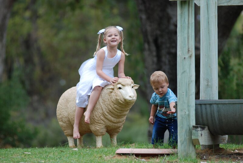Children with sheep statue