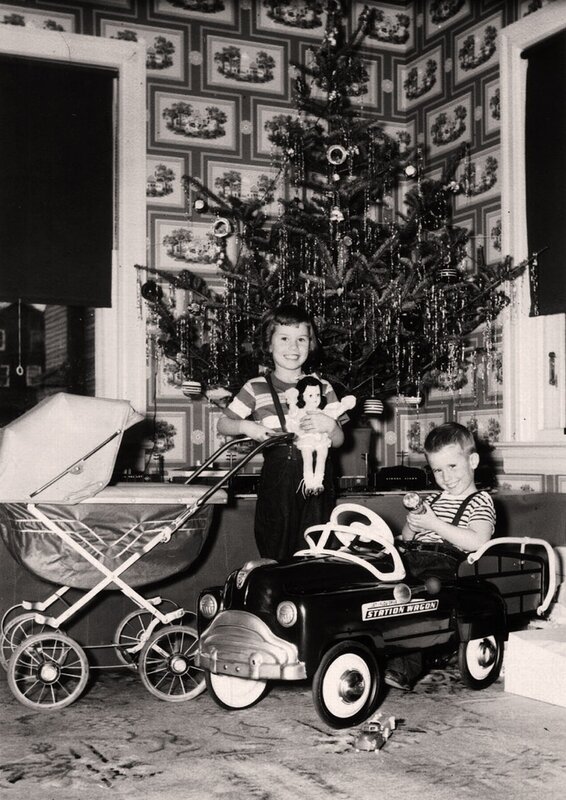 Children with toys near Christmas tree